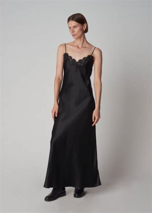 Elegant black satin slip dress with lace detailing, offering a luxurious and simple choice for a formal winter wedding.
