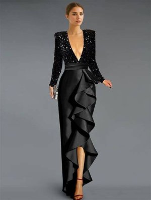 A dazzling black sequin A-line cocktail dress with a boat neckline and three-quarter sleeves, accessorized with black pumps and a faux fur wrap.